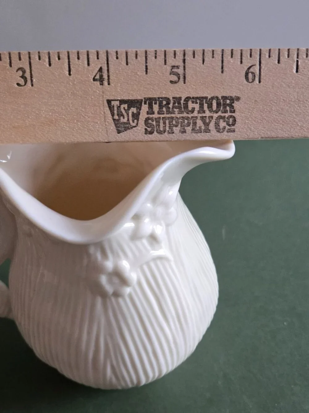 Pair of Ivory Bisque Pitchers